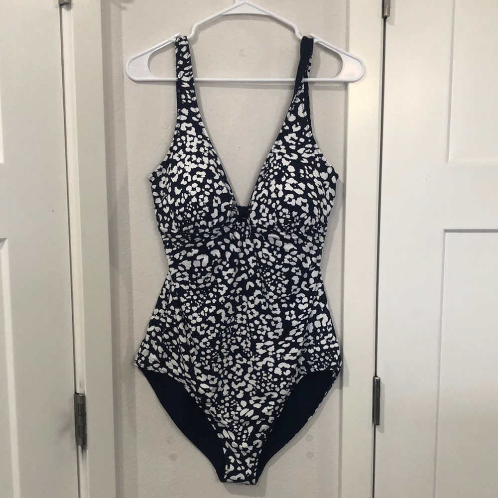 Women’s one piece, reversible swimsuit, blue on one side, blue, and white